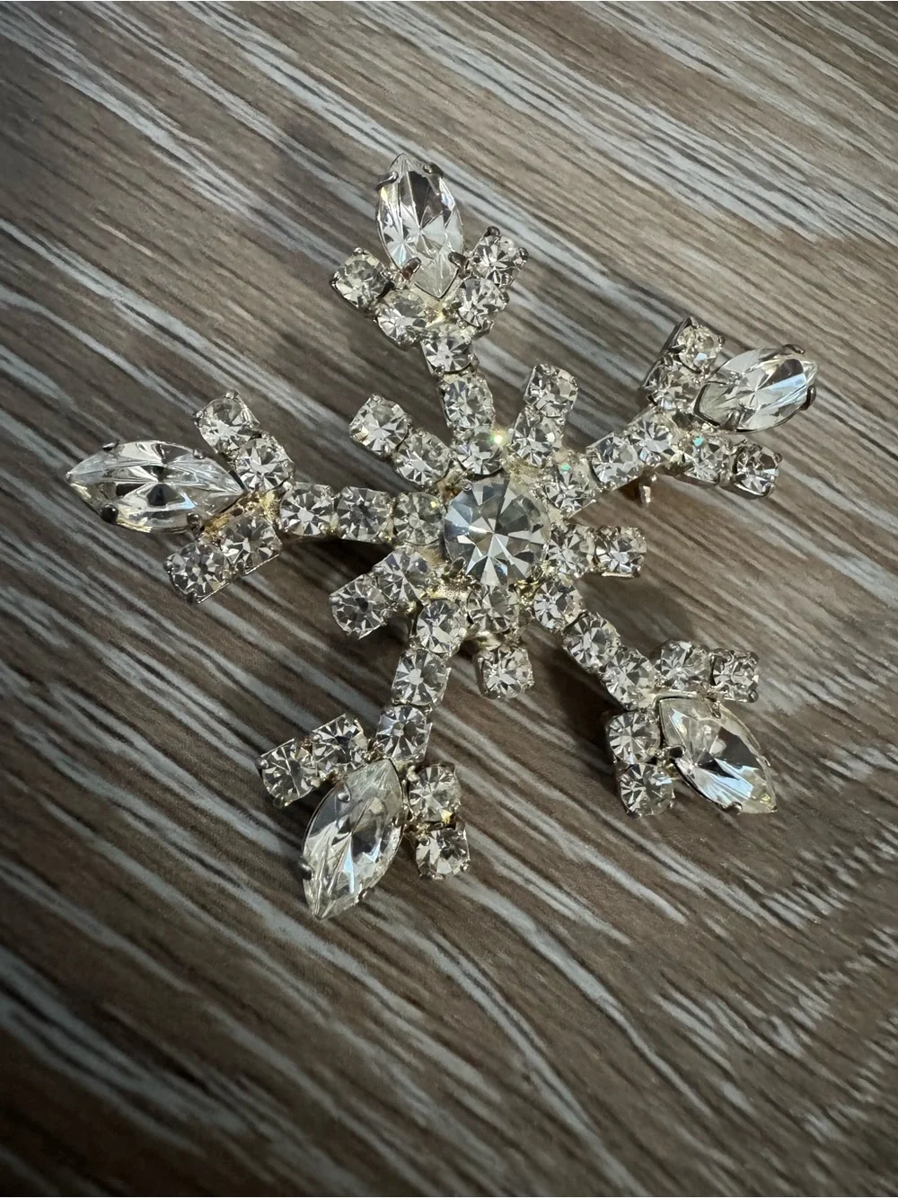 OTC vintage snowflake silver tone brooch with clear gemstones